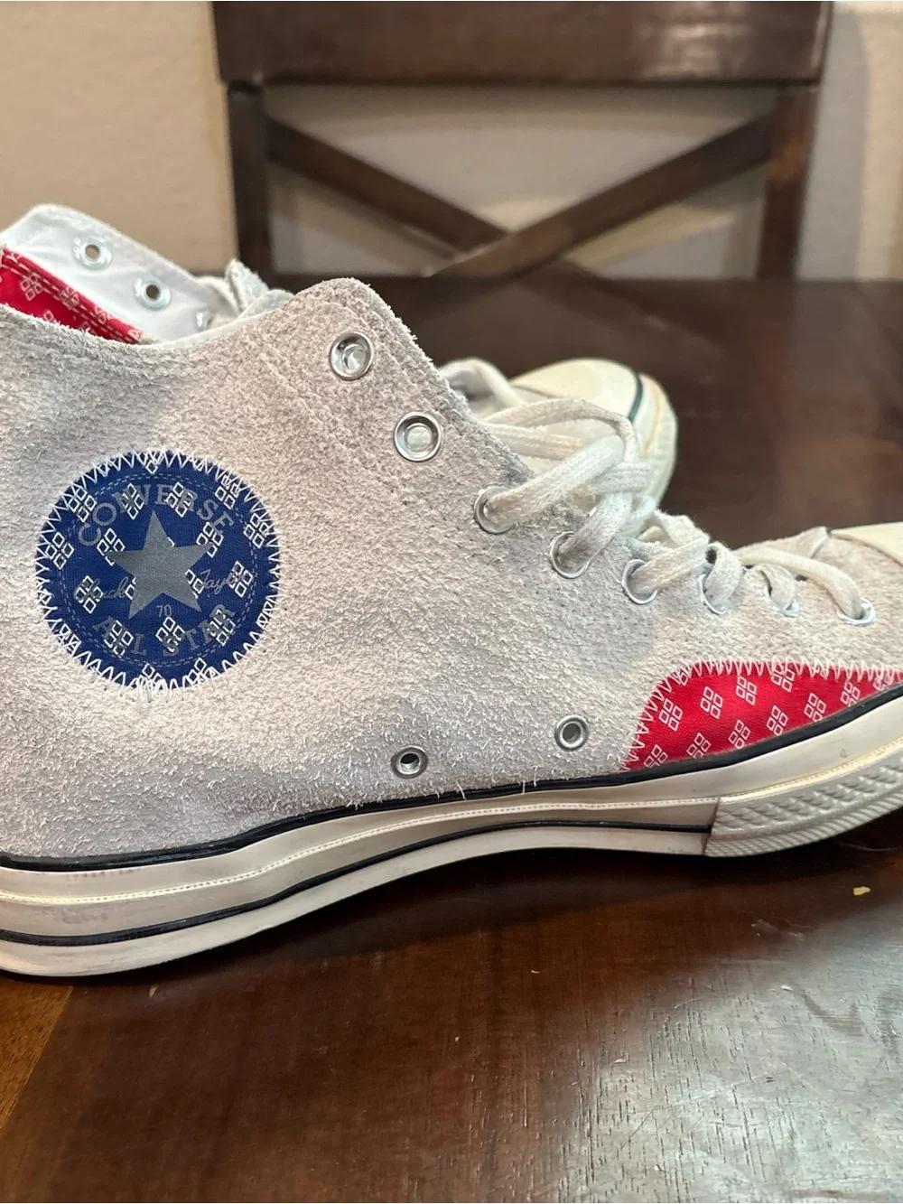 Converse Chuck Taylor’s White High Top Sneakers with Red and Blue Accents